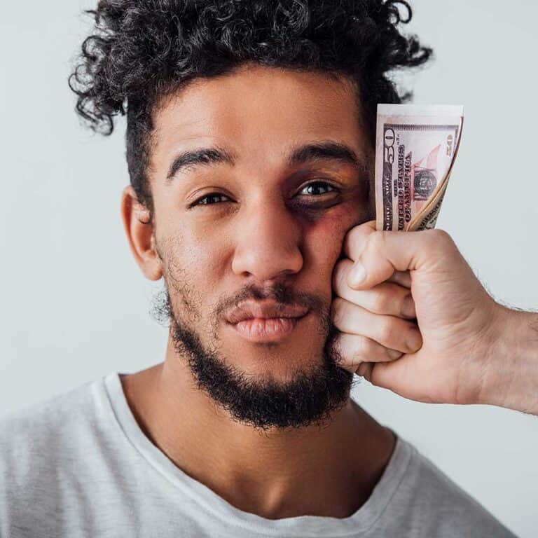 man getting scammed and getting punched in face by fist full of cash